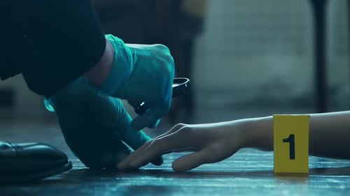 Gloved Hand Examines Crime Scene with Magnifying Glass