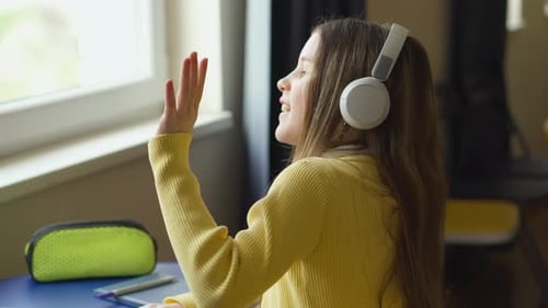 Teenage Student Learning Online with Laptop and Headphones