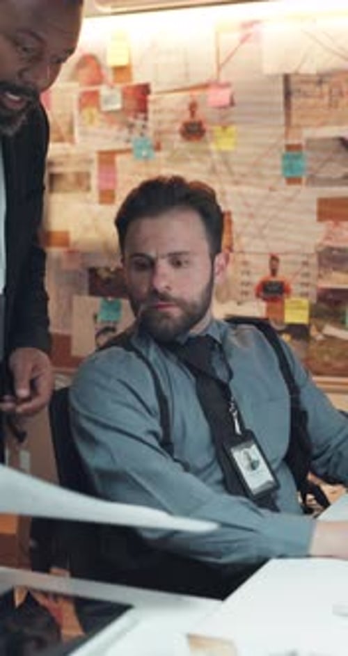 Conversation, investigation and photograph with detective team in office for evidence review