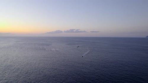 Aerial View of Boats Sailing at Sunrise