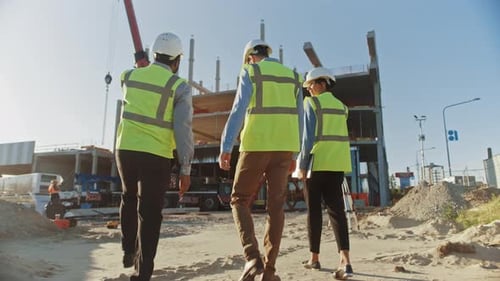 Diverse Team of Specialists Inspect Commercial, Industrial Building Construction Site. Real Estate