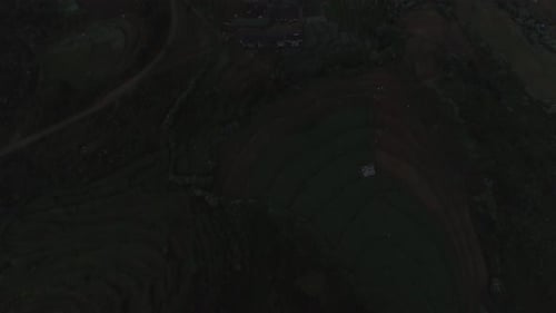 Cinematic drone shot - Aerial view of a plantation located on a cliff in Sri Lanka.