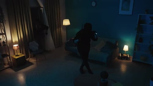 Two Shadowy Figures with Flashlight Enter House at Night