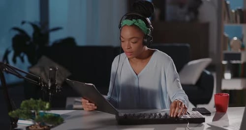 Woman Creating Music at Home in the Evening