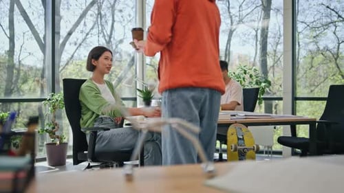 Office Workers Sitting Boardroom Working Together Young Man Bringing Coffee