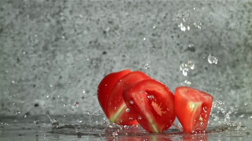 Fresh Tomatoes with a Splash of Water Filmed on a Highspeed Camera at 1000 Fps