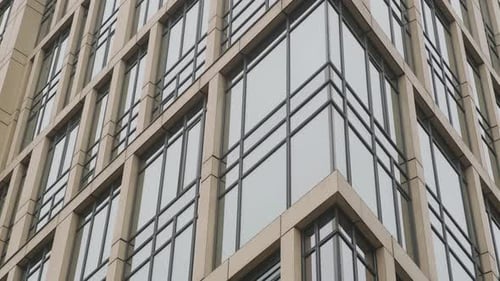 Facade of Modern Highrise Building with Glass Windows