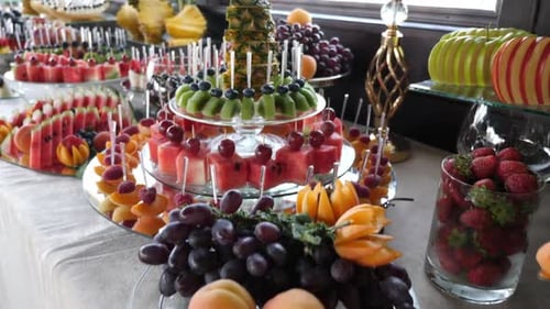 F60. Sweet buffet with various fruits. Decoration of a fruit and berry buffet table.