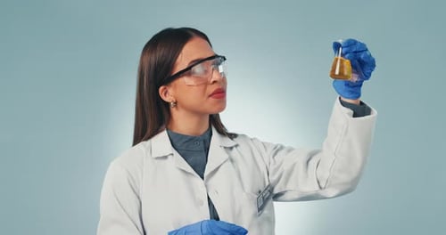 Doctor, smile and okay with a science woman in studio on a gray background for research