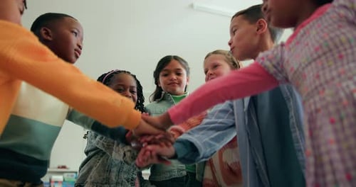 Kids, group and stack hands for learning, support and education in elementary school