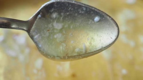 Top View of Spoon Pick Fresh Honey
