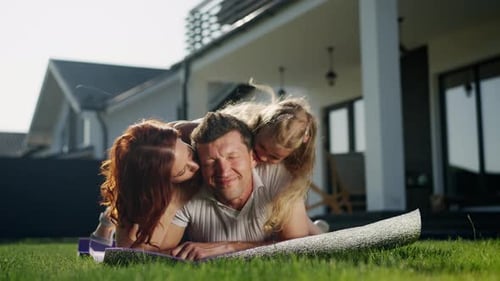 Playful Family Fun in Sunny Suburban Backyard