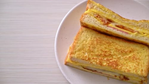 Egg and Bacon Breakfast Sandwich on Plate