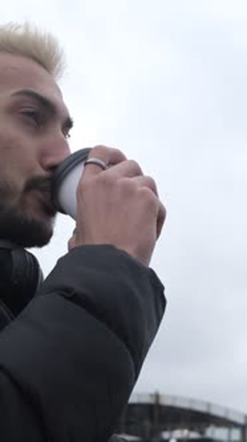 Young Adult Drinks Beverage Outside