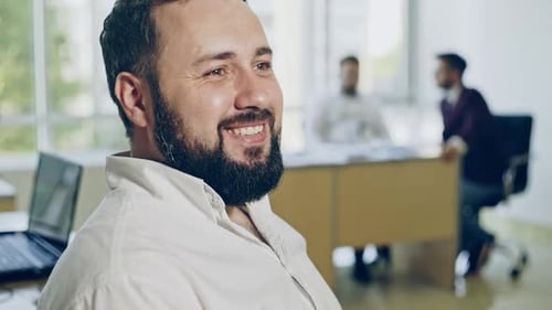 Smiling Man in Office