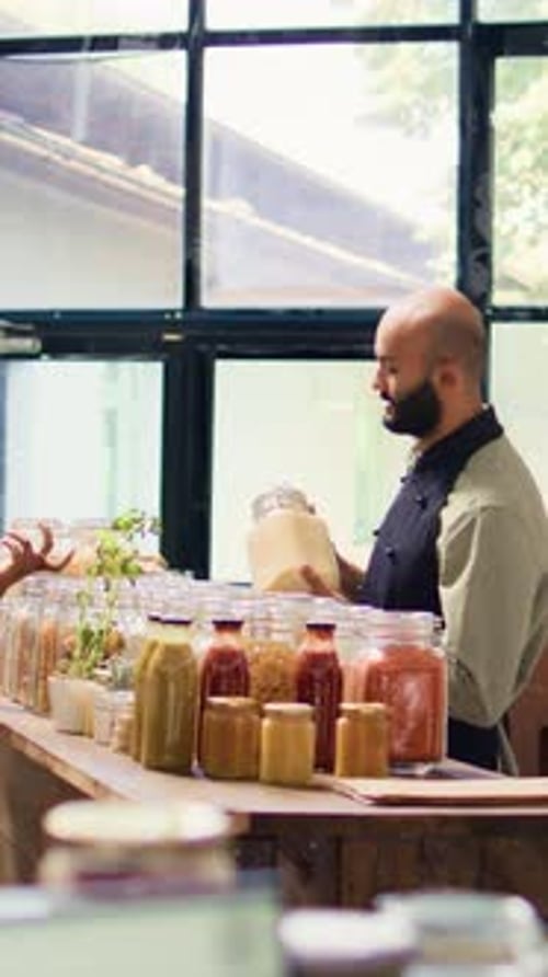 Clerk Assists Customer in Retail Store