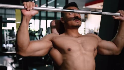 Sport Athlete man Workout Shoulder Press with barbell in Fitness gym
