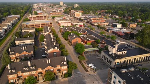 Sun shining on downtown of Dearborn township in Michigan, USA, aerial view