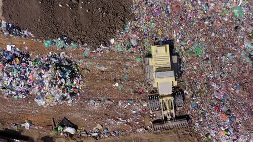 Aerial View of Bulldozer Sorting Trash in Landfill