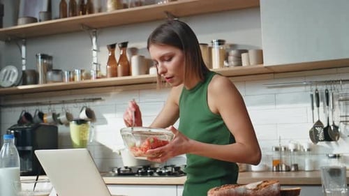 Freelancer Working Kitchen Eating Salad at Home Serious Woman Looking Laptop