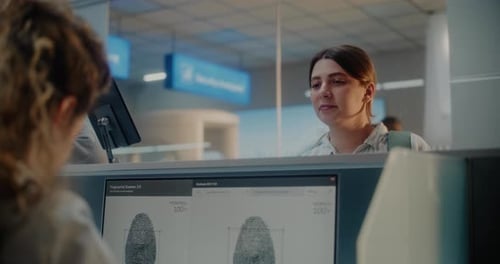 Airport Checkin Counter Woman Giving Documents and Airplane Ticket to Female Airline Agent