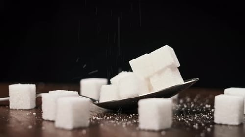 Close Up of Sugar Cubes on a Spoon