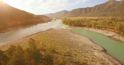 Low Altitude Flight Over Fresh Fast Mountain River with Rocks at Sunny Summer Morning