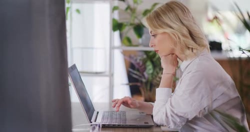 Woman Working Remotely From Home on Laptop