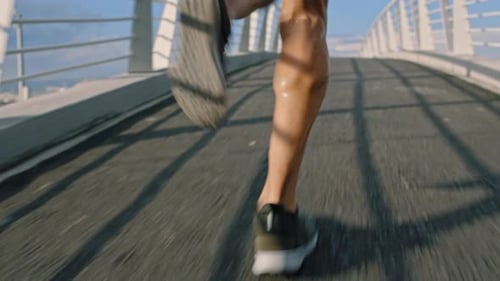 Fitness, city and legs running on a bridge in a cardio workout or exercise with speed training