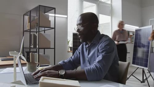 Timelapse of Black Male Industrial Designer Working at Green Energy Company