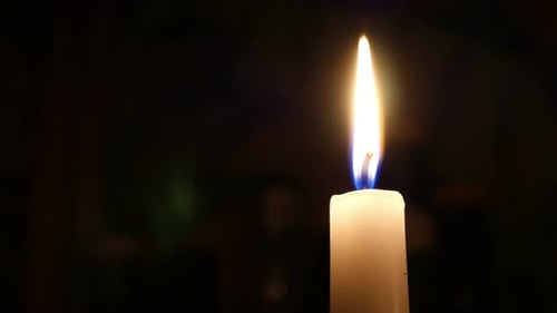 Single Candle Flame on Blackk