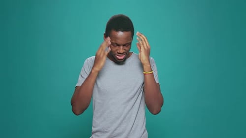 Young Adult Demonstrates Symptoms of Cold or Flu