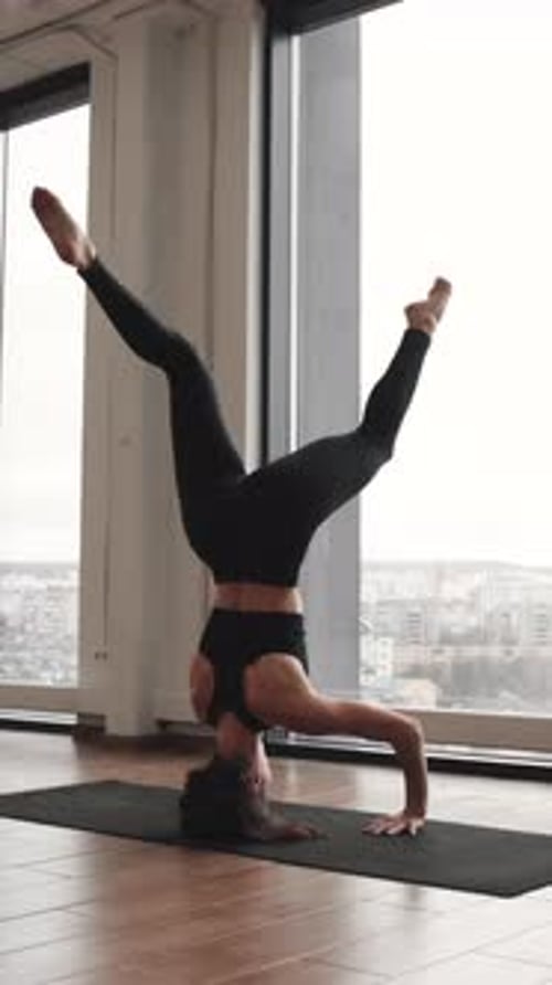 Woman Doing Headstand Yoga Pose