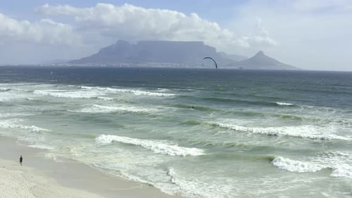 4k video footage of kite surfers surfing on a beach in Cape Town, South Africa