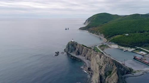 Aerial View of Rocky Cliff with an Old Lighthouse on Pacific Coast Beautiful Panoramic Seascape