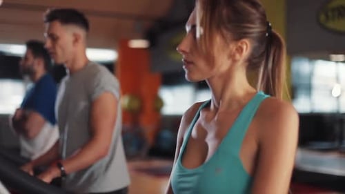 Attractive Young Woman on Treadmill in Gym Sportsman Sport Fitness Internet Face Technology Fit