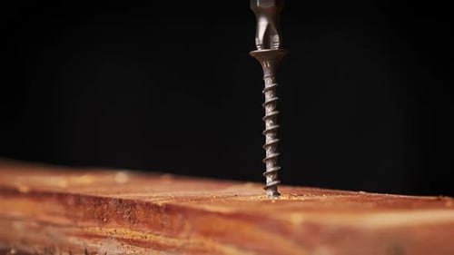 Drill Driving Screw Into Wood Close Up