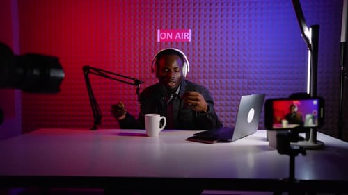 Man Recording Podcast in Professional Studio Setting