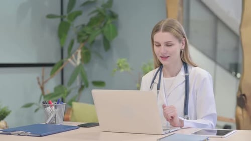 Doctor Doing Online Video Chat in Clinic