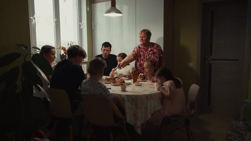 Large Family Sharing a Meal Together at Home