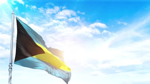Bahamas National Flag Waving Realistically in Bright Blue Sky