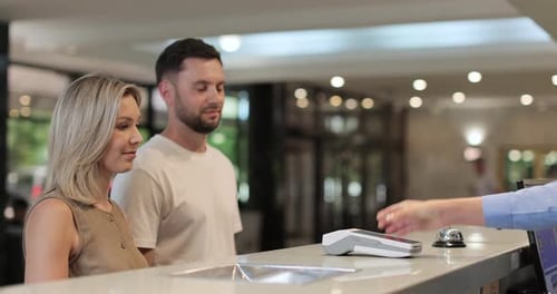 Woman Makes Nfc Payment with Mobile Phone at Pos Terminal Paying for Room at Hotel Person at