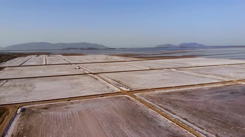 View of a Salt Flat Factory Besides the Sea Drone Shot of Salt Extraction
