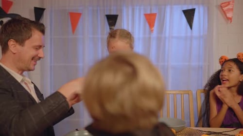 Family Celebrates Halloween Together at Home