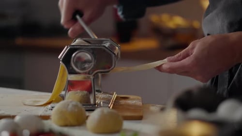 Pasta, The Cook Uses Pasta Machines In The Home Kitchen Of A Housewife. An Experienced Chef