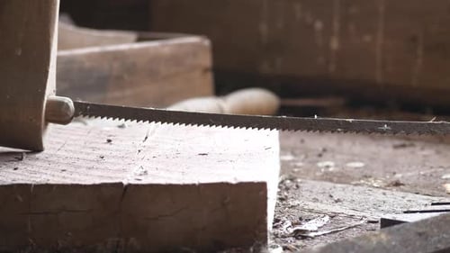 Carpenter's handsaw on worktable. Close up
