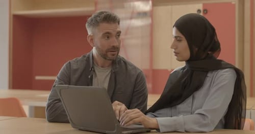 Business people meeting discussing technology on laptop in office
