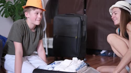 Siblings Packing Suitcase for Summer Travel Adventure