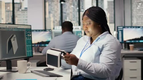 Engineer in Office Testing Innovative Solar Powered Device Turning Lights on