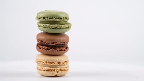A tall macaron tower spins gracefully.